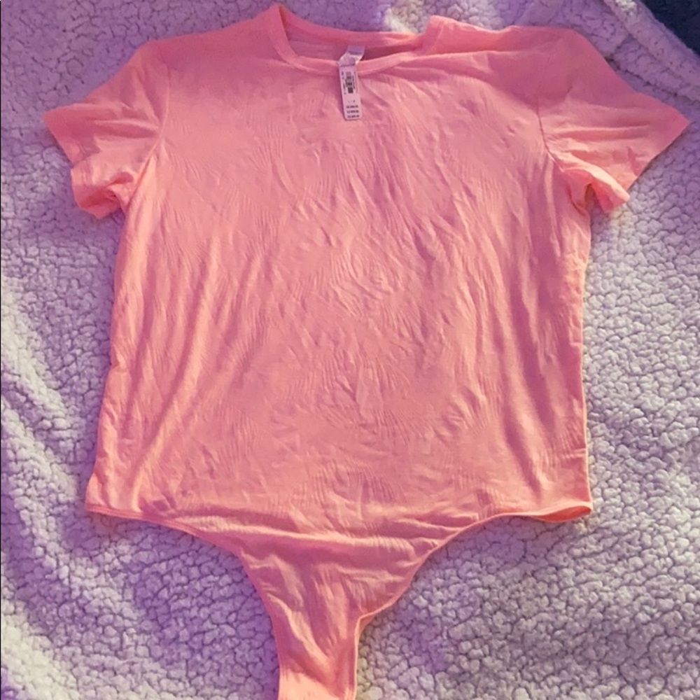Pink body suit